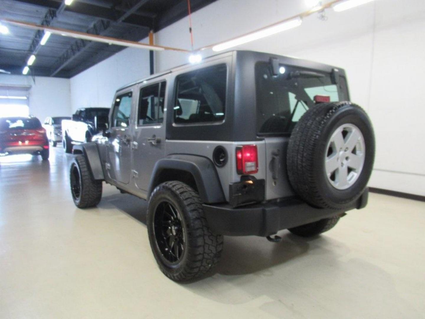 2018 Billet Silver Metallic Clearcoat /Black Jeep Wrangler JK Unlimited Sport (1C4BJWDG6JL) with an 3.6L V6 24V VVT engine, Automatic transmission, located at 15300 Midway Rd., Addison, TX, 75001, (972) 702-0011, 32.958321, -96.838074 - HOME OF THE NO HAGGLE PRICE - WHOLESALE PRICES TO THE PUBLIC!! 4D Sport Utility, 3.6L V6 24V VVT, 4WD, Silver, ABS brakes, Compass, Electronic Stability Control, Low tire pressure warning, Traction control.<br><br>Silver 2018 Jeep Wrangler JK Unlimited Sport<br><br>Recent Arrival!<br><br>Awards:<br> - Photo#3