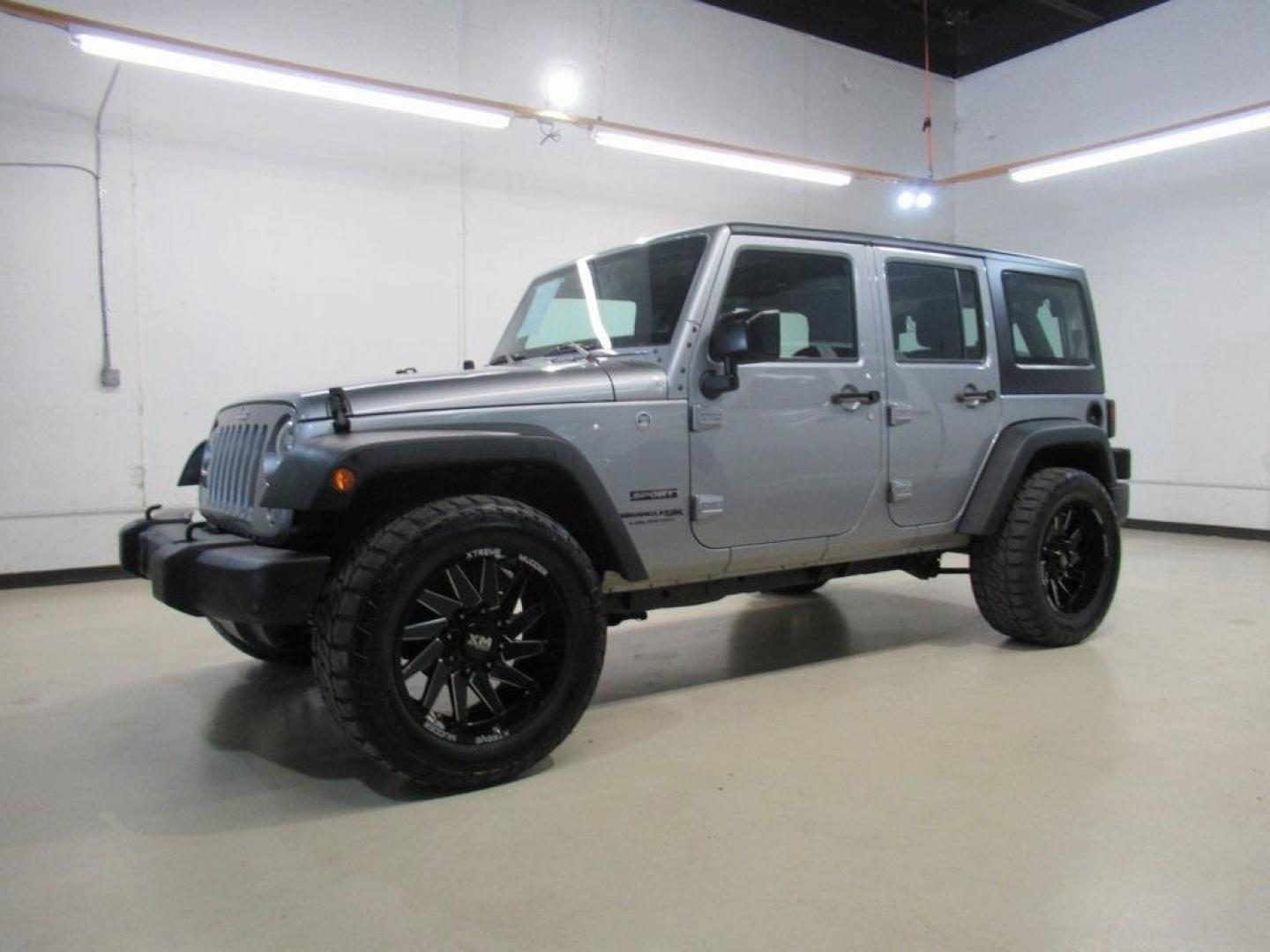 2018 Billet Silver Metallic Clearcoat /Black Jeep Wrangler JK Unlimited Sport (1C4BJWDG6JL) with an 3.6L V6 24V VVT engine, Automatic transmission, located at 15300 Midway Rd., Addison, TX, 75001, (972) 702-0011, 32.958321, -96.838074 - HOME OF THE NO HAGGLE PRICE - WHOLESALE PRICES TO THE PUBLIC!! 4D Sport Utility, 3.6L V6 24V VVT, 4WD, Silver, ABS brakes, Compass, Electronic Stability Control, Low tire pressure warning, Traction control.<br><br>Silver 2018 Jeep Wrangler JK Unlimited Sport<br><br>Recent Arrival!<br><br>Awards:<br> - Photo#4