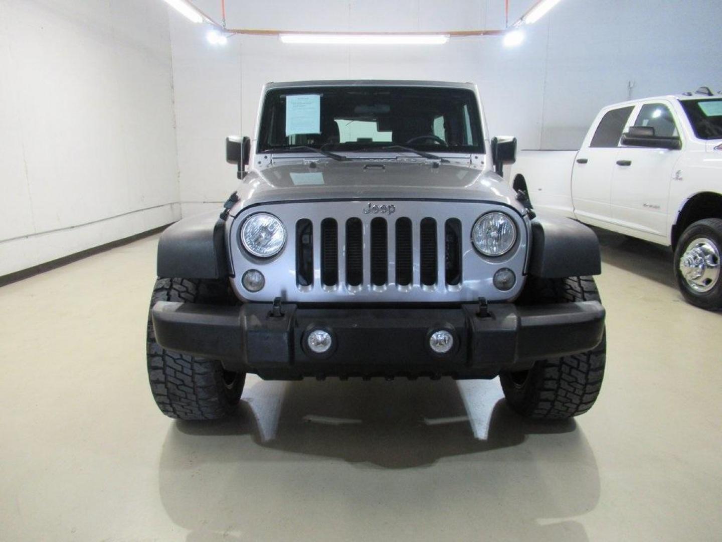 2018 Billet Silver Metallic Clearcoat /Black Jeep Wrangler JK Unlimited Sport (1C4BJWDG6JL) with an 3.6L V6 24V VVT engine, Automatic transmission, located at 15300 Midway Rd., Addison, TX, 75001, (972) 702-0011, 32.958321, -96.838074 - HOME OF THE NO HAGGLE PRICE - WHOLESALE PRICES TO THE PUBLIC!! 4D Sport Utility, 3.6L V6 24V VVT, 4WD, Silver, ABS brakes, Compass, Electronic Stability Control, Low tire pressure warning, Traction control.<br><br>Silver 2018 Jeep Wrangler JK Unlimited Sport<br><br>Recent Arrival!<br><br>Awards:<br> - Photo#5