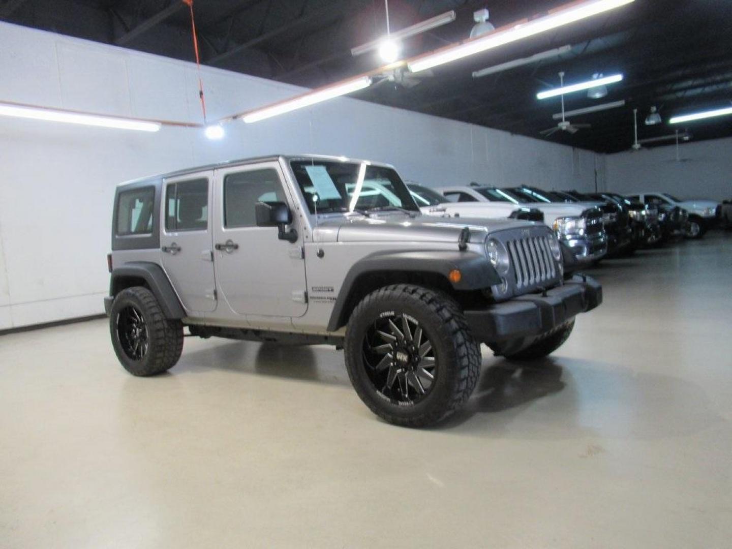 2018 Billet Silver Metallic Clearcoat /Black Jeep Wrangler JK Unlimited Sport (1C4BJWDG6JL) with an 3.6L V6 24V VVT engine, Automatic transmission, located at 15300 Midway Rd., Addison, TX, 75001, (972) 702-0011, 32.958321, -96.838074 - HOME OF THE NO HAGGLE PRICE - WHOLESALE PRICES TO THE PUBLIC!! 4D Sport Utility, 3.6L V6 24V VVT, 4WD, Silver, ABS brakes, Compass, Electronic Stability Control, Low tire pressure warning, Traction control.<br><br>Silver 2018 Jeep Wrangler JK Unlimited Sport<br><br>Recent Arrival!<br><br>Awards:<br> - Photo#6