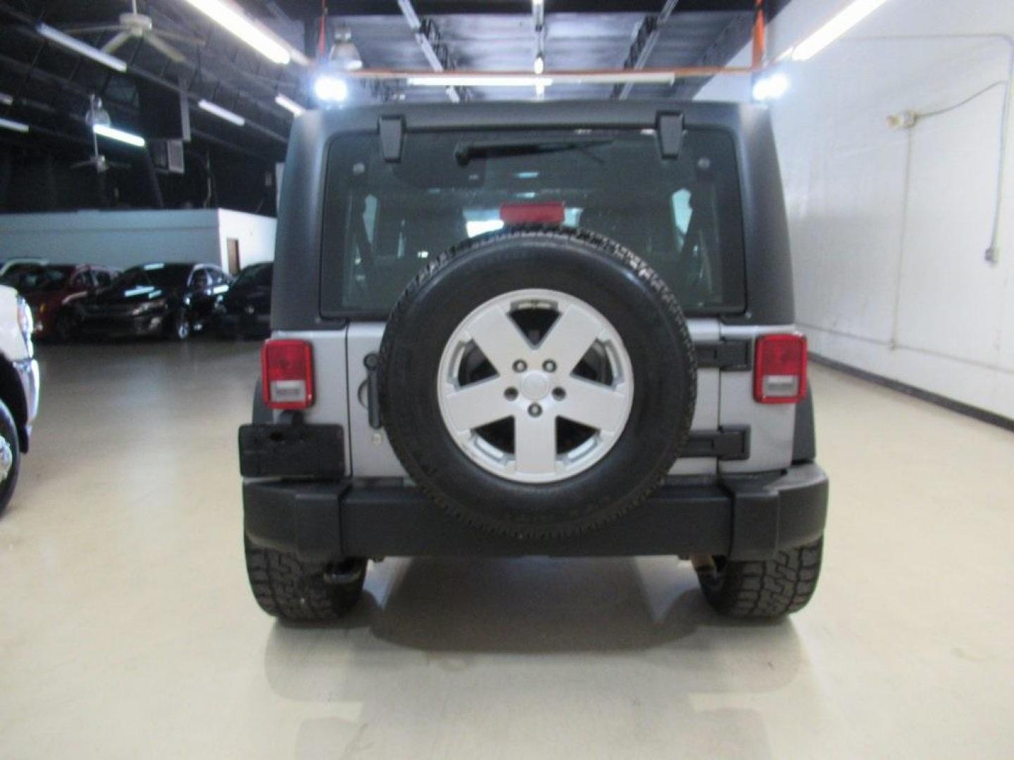 2018 Billet Silver Metallic Clearcoat /Black Jeep Wrangler JK Unlimited Sport (1C4BJWDG6JL) with an 3.6L V6 24V VVT engine, Automatic transmission, located at 15300 Midway Rd., Addison, TX, 75001, (972) 702-0011, 32.958321, -96.838074 - HOME OF THE NO HAGGLE PRICE - WHOLESALE PRICES TO THE PUBLIC!! 4D Sport Utility, 3.6L V6 24V VVT, 4WD, Silver, ABS brakes, Compass, Electronic Stability Control, Low tire pressure warning, Traction control.<br><br>Silver 2018 Jeep Wrangler JK Unlimited Sport<br><br>Recent Arrival!<br><br>Awards:<br> - Photo#7